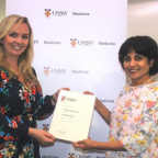 Dr Emma Barrett ( left) receiving her scholarship from Professor Minoti Apte 